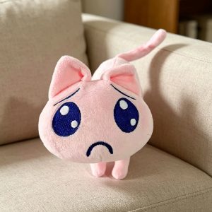 ふわふわなピンクの困り顔ネコぬいぐるみ
